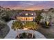 Aerial shot of a beautiful two-story home with a welcoming front porch and mature trees at 4051 Colonel Vanderhorst Cir, Mount Pleasant, SC 29466