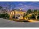 Inviting exterior of a home with a charming front porch, lush landscaping, and a winding driveway at 4051 Colonel Vanderhorst Cir, Mount Pleasant, SC 29466