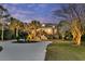 A picturesque property with a long driveway, lush greenery, and a welcoming exterior at 4051 Colonel Vanderhorst Cir, Mount Pleasant, SC 29466