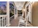 Inviting front porch with white rocking chairs, offering a relaxing outdoor space at 4051 Colonel Vanderhorst Cir, Mount Pleasant, SC 29466