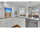 Bright kitchen with an island, barstool seating, stainless appliances, and views to the living room at 4051 Colonel Vanderhorst Cir, Mount Pleasant, SC 29466