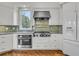 Kitchen features stainless appliances, tile backsplash, and hardwood floors at 4051 Colonel Vanderhorst Cir, Mount Pleasant, SC 29466