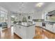 Spacious kitchen with a center island, stainless steel appliances, and views out to a seating area and covered patio at 4051 Colonel Vanderhorst Cir, Mount Pleasant, SC 29466