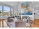 Large living room featuring art, large windows, and four comfortable round chairs at 4051 Colonel Vanderhorst Cir, Mount Pleasant, SC 29466