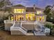 A sprawling house with a multi-level deck offers ample outdoor living, complemented by lush landscaping and natural beauty at 4051 Colonel Vanderhorst Cir, Mount Pleasant, SC 29466
