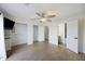 Spacious bedroom with a ceiling fan, two closets, and two doors to the bathroom and hallway at 4789 Arco Ln, North Charleston, SC 29418