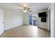 Well-lit bedroom with ceiling fan, mounted TV, balcony access and water views at 4789 Arco Ln, North Charleston, SC 29418