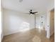 Spacious bedroom with neutral walls, stylish ceiling fan, and gleaming hardwood floors at 4789 Arco Ln, North Charleston, SC 29418