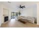 Bright living room with fireplace, ceiling fan and sliding glass doors that opens to a deck at 4789 Arco Ln, North Charleston, SC 29418