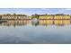 Beautiful waterfront homes reflect on a serene lake with a peaceful kayak ride at 4789 Arco Ln, North Charleston, SC 29418