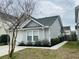 Charming single-Gathering home featuring well-maintained landscaping and a welcoming entrance at 4957 Trump St, North Charleston, SC 29420