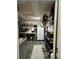 Organized garage featuring a workbench, storage shelves, and tools, providing functional workspace at 4957 Trump St, North Charleston, SC 29420