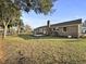 Brick home backyard featuring a patio, landscaping and mature trees at 5330 Waterview Dr, North Charleston, SC 29418