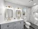 Bright bathroom featuring double sinks, and a marble-tiled shower in a modern, clean design at 5330 Waterview Dr, North Charleston, SC 29418