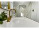 Bright bathroom showcasing a gold faucet and marble countertop with modern fixtures and elegant design at 5330 Waterview Dr, North Charleston, SC 29418