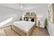 Bright bedroom featuring a wooden bed frame, soft rug, and stylish decor under a ceiling fan at 5330 Waterview Dr, North Charleston, SC 29418