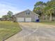 Detached garage with brick exterior and a concrete driveway at 5330 Waterview Dr, North Charleston, SC 29418