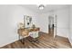Home office with hardwood floors, a writing desk and chair, and a view into another room at 5330 Waterview Dr, North Charleston, SC 29418