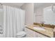 Bathroom featuring white cabinets with a stone countertop and a shower with a white curtain at 5409 Clairmont Ln, North Charleston, SC 29420