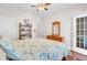 Bedroom with wooden accents, hardwood floors, and a doorway leading to the rest of the home at 5409 Clairmont Ln, North Charleston, SC 29420