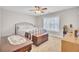 Bedroom featuring a bed frame, vintage trunk, and window with natural lighting at 5409 Clairmont Ln, North Charleston, SC 29420