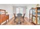 Elegant dining room with a decorative chandelier, a vintage display cabinet, and a patterned rug at 5409 Clairmont Ln, North Charleston, SC 29420