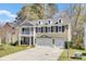 Two story house with a two car garage and a porch at 5409 Clairmont Ln, North Charleston, SC 29420