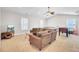 Open living room featuring plush sofa, table tennis and hardwood floors at 5409 Clairmont Ln, North Charleston, SC 29420