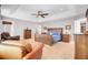 Spacious main bedroom featuring a tray ceiling, ceiling fan, and wooden furniture set at 5409 Clairmont Ln, North Charleston, SC 29420