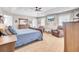 Spacious main bedroom features a tray ceiling, carpet, and large windows for natural light at 5409 Clairmont Ln, North Charleston, SC 29420