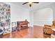 Bright office space featuring hardwood floors, a charming piano, comfortable seating, and ample natural light at 5409 Clairmont Ln, North Charleston, SC 29420
