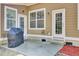 Outdoor patio with grill, entry doors, and view of the home's exterior at 5409 Clairmont Ln, North Charleston, SC 29420