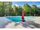 Community swimming pool featuring a large deck area with lounge chairs and wooded surroundings at 5409 Clairmont Ln, North Charleston, SC 29420