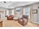 Cozy sitting area with two leather armchairs and a marble topped table at 5409 Clairmont Ln, North Charleston, SC 29420