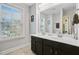 Well-lit bathroom with double sinks and a large mirror at 5415 Clairmont Ln, North Charleston, SC 29420