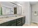 Bathroom with double vanity, granite counters, and a large mirror at 5415 Clairmont Ln, North Charleston, SC 29420