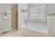 Bathroom featuring a soaking tub, walk in shower, and neutral color palette at 5415 Clairmont Ln, North Charleston, SC 29420
