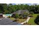 Aerial view of community pool featuring a clubhouse and ample parking at 5415 Clairmont Ln, North Charleston, SC 29420