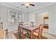 Bright dining room featuring hardwood floors, natural light, and traditional furniture at 5415 Clairmont Ln, North Charleston, SC 29420