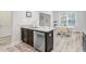 Kitchen area features dark cabinets, stainless steel appliances, a double sink, and granite countertops at 5415 Clairmont Ln, North Charleston, SC 29420