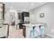 Bright, open kitchen boasts dark cabinets, stainless steel appliances, granite countertops, and seating at 5415 Clairmont Ln, North Charleston, SC 29420