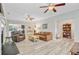 Spacious living room with hardwood floors, neutral walls, and three ceiling fans at 5415 Clairmont Ln, North Charleston, SC 29420