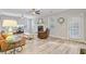 Open-concept living room with hardwood floors, neutral walls, and a view of the fireplace at 5415 Clairmont Ln, North Charleston, SC 29420