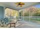 Relaxing screened porch with outdoor seating and ceiling fan at 5415 Clairmont Ln, North Charleston, SC 29420