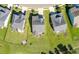 Aerial view of a home showcasing a well-kept lawn, backyard fire pit, and neighborhood layout at 543 Pendleton Dr, Moncks Corner, SC 29461