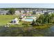 Aerial view of community amenities, including a pool, playground, lake access, and well-maintained landscaping at 543 Pendleton Dr, Moncks Corner, SC 29461
