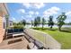 Enjoy outdoor living on this deck overlooking a serene lake and well-manicured lawn at 543 Pendleton Dr, Moncks Corner, SC 29461