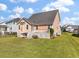 Well-maintained backyard with a cozy deck and stairs, perfect for outdoor relaxation and entertaining at 543 Pendleton Dr, Moncks Corner, SC 29461