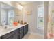 Stylish bathroom with a large mirror, vanity with dark cabinets, and ample counter space at 543 Pendleton Dr, Moncks Corner, SC 29461