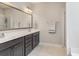 Bathroom with double vanity, large mirror, and tile floors at 543 Pendleton Dr, Moncks Corner, SC 29461